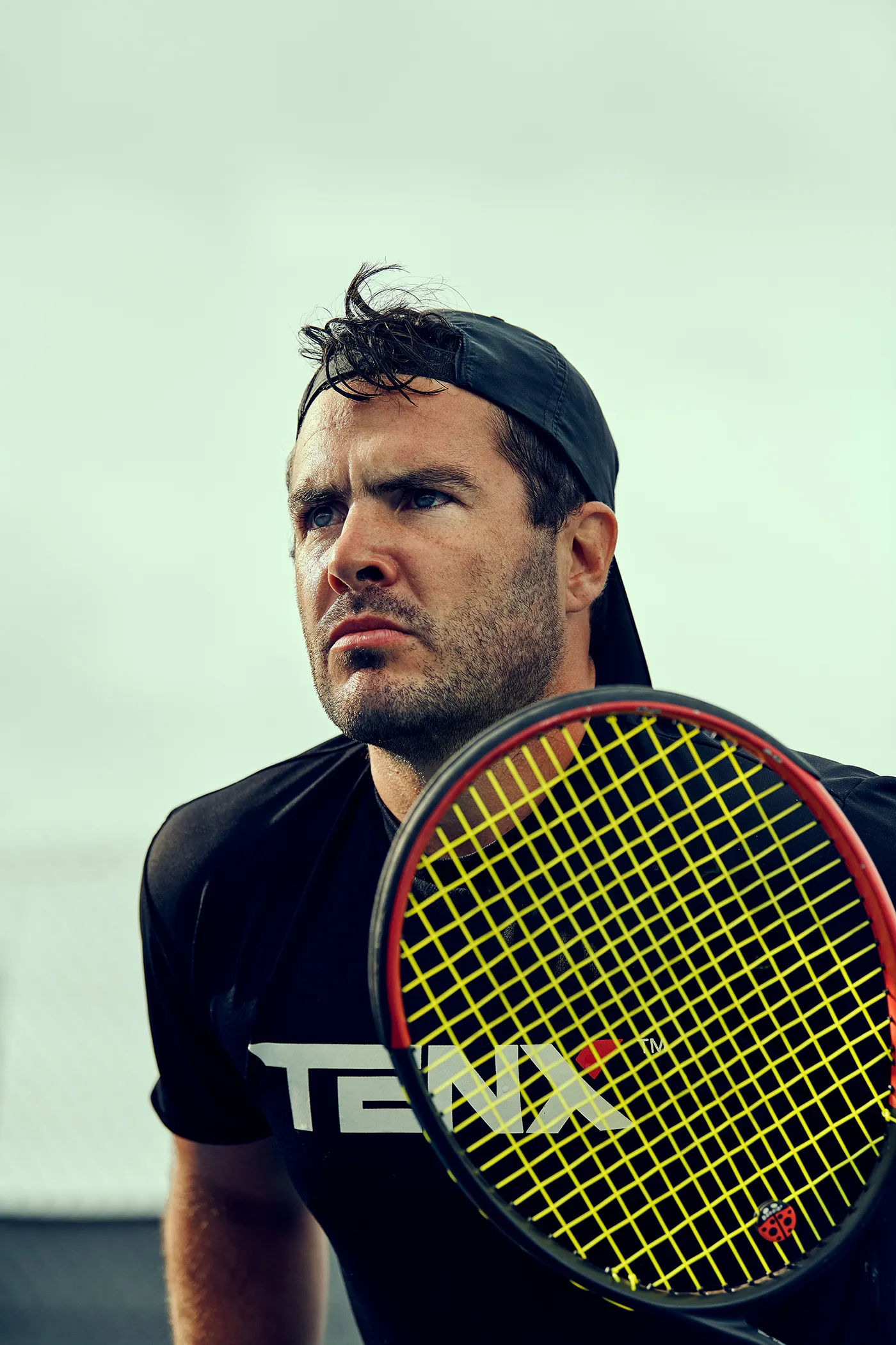 Profile picture of a man with a tennis racquet