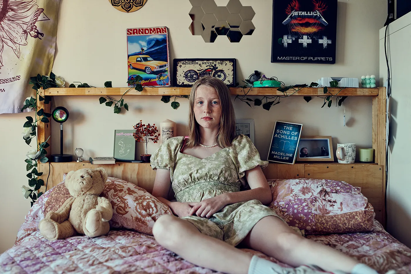 Girl sitting on her bed