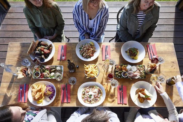 Jack Rabbit Winery. Overhead shot of table with food, wine and people socialising.