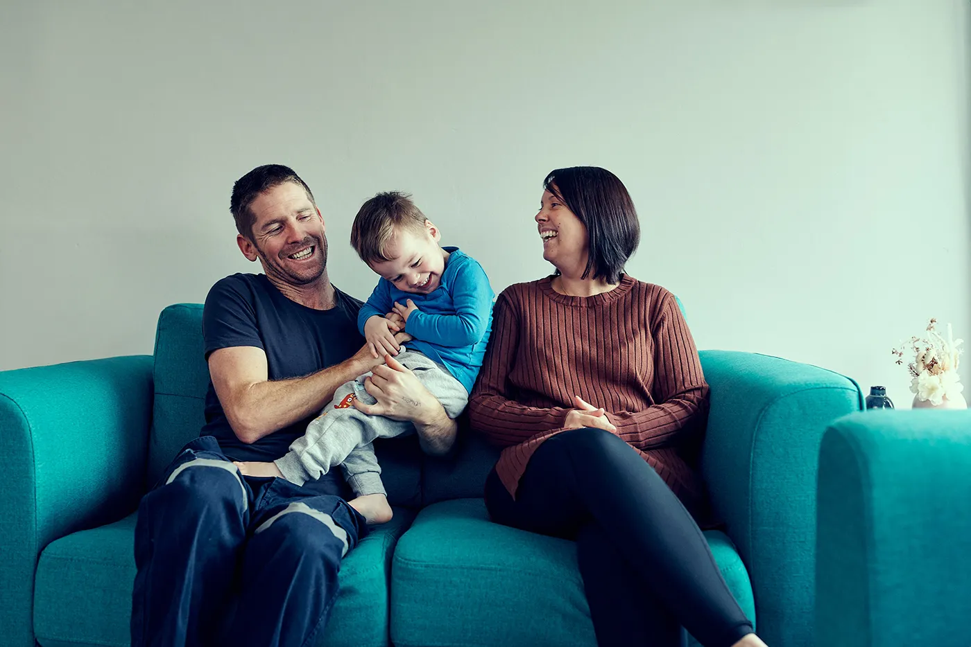 Family sitting on a couch